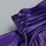 satin wrap halter gown with flower in purple