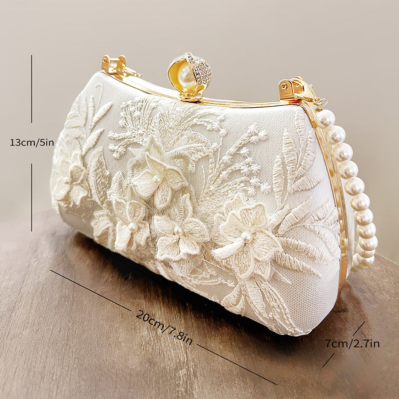 FLORAL LACE PEARL CLUTCH